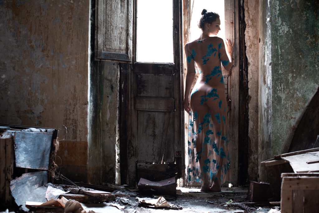 Rachel Cook standing in an abandoned paper mill in the Valle de Ferriere.